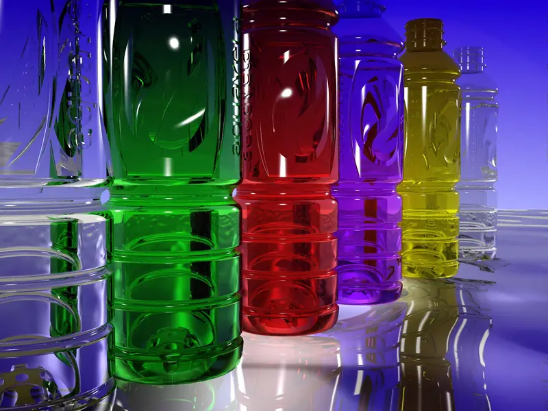 Coloured PET beverage bottles on a reflective surface